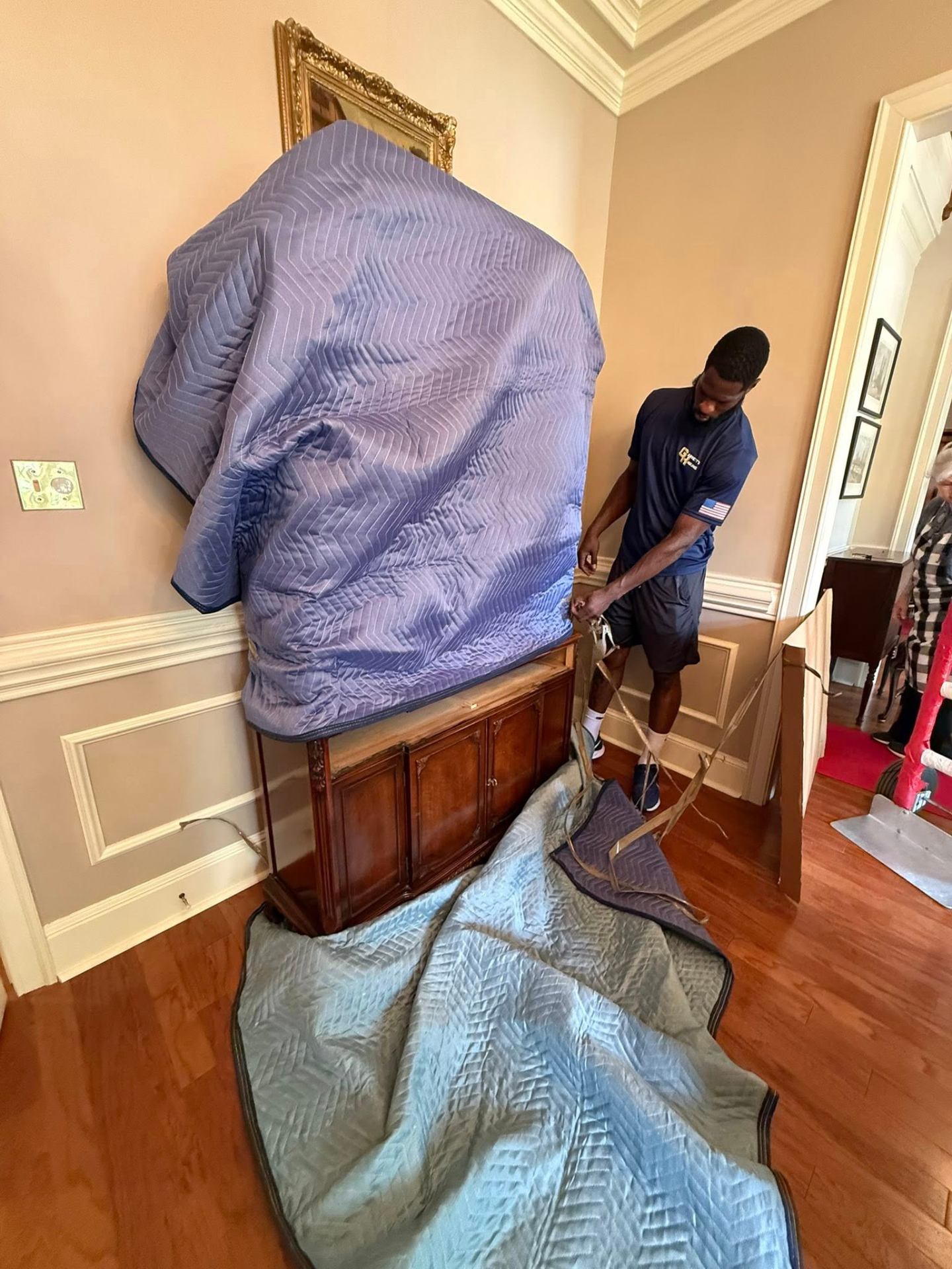 Desean wrapping a buffet, mid-job.