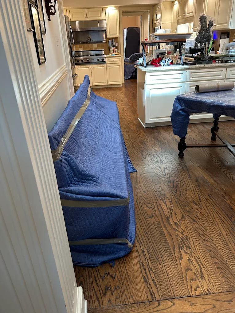 Sofa wrapped, taped, ready to roll out the front door.